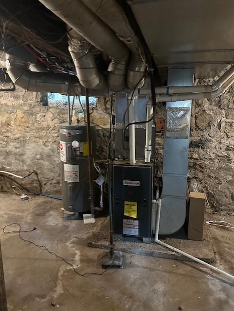 9600 E 16th St, Independence, MO 64052 - utility room with water heater