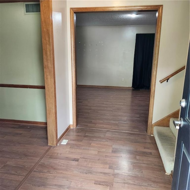 9318 Greenway Ln, Lenexa, KS 66215 - hallway featuring stairs and wood finished floors