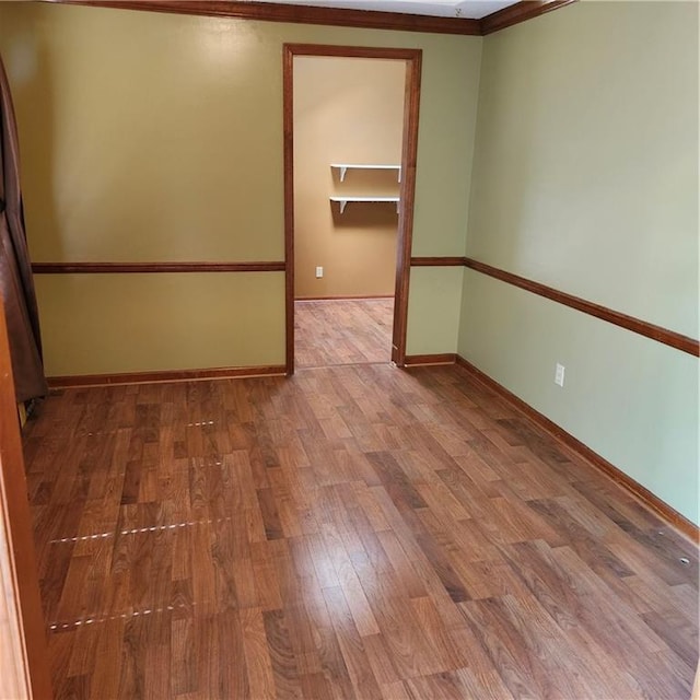 9318 Greenway Ln, Lenexa, KS 66215 - unfurnished room featuring wood finished floors and ornamental molding