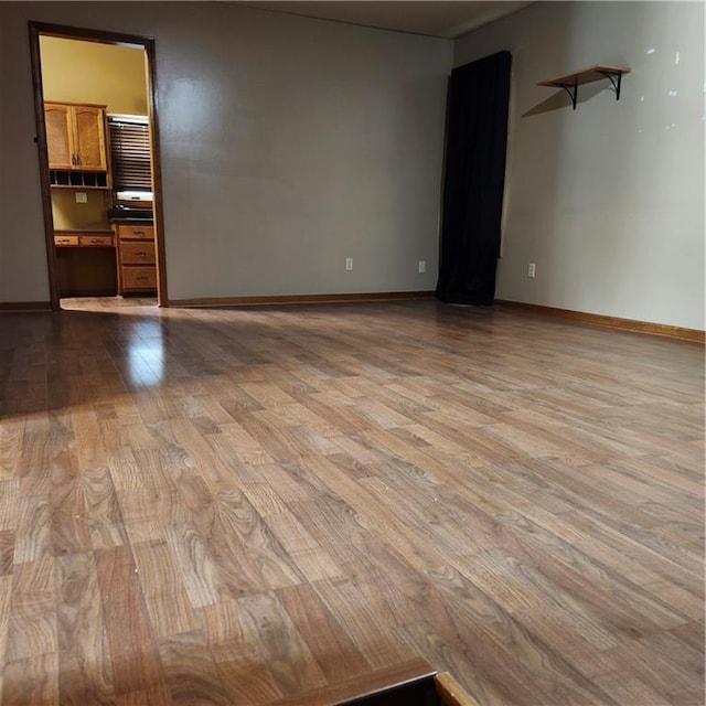 9318 Greenway Ln, Lenexa, KS 66215 - spare room with wood finished floors and baseboards