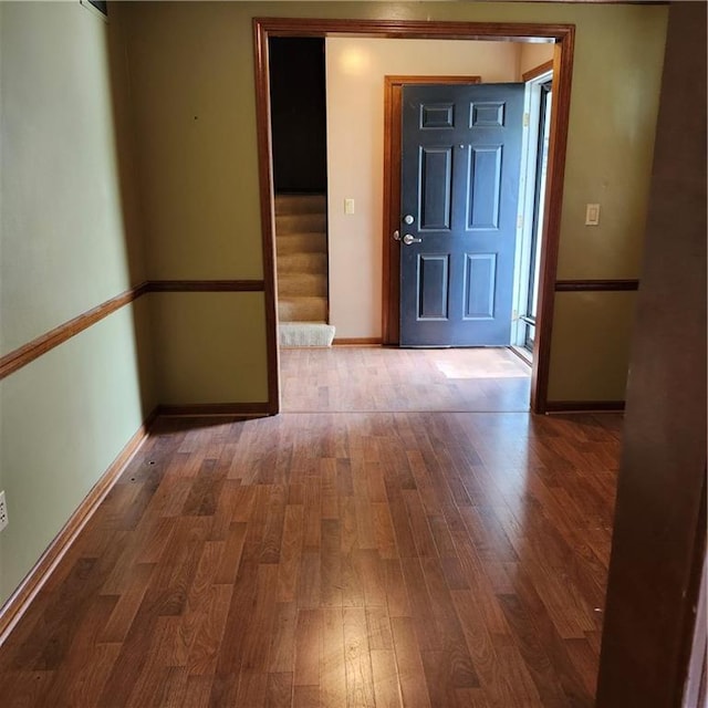 9318 Greenway Ln, Lenexa, KS 66215 - foyer featuring wood finished floors and stairway