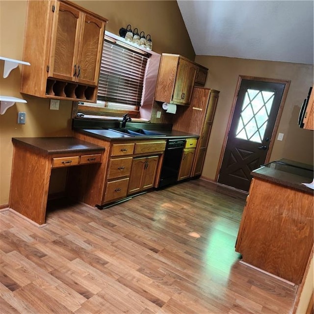 9318 Greenway Ln, Lenexa, KS 66215 - kitchen with dishwasher, dark countertops, light wood-type flooring, vaulted ceiling, and brown cabinetry