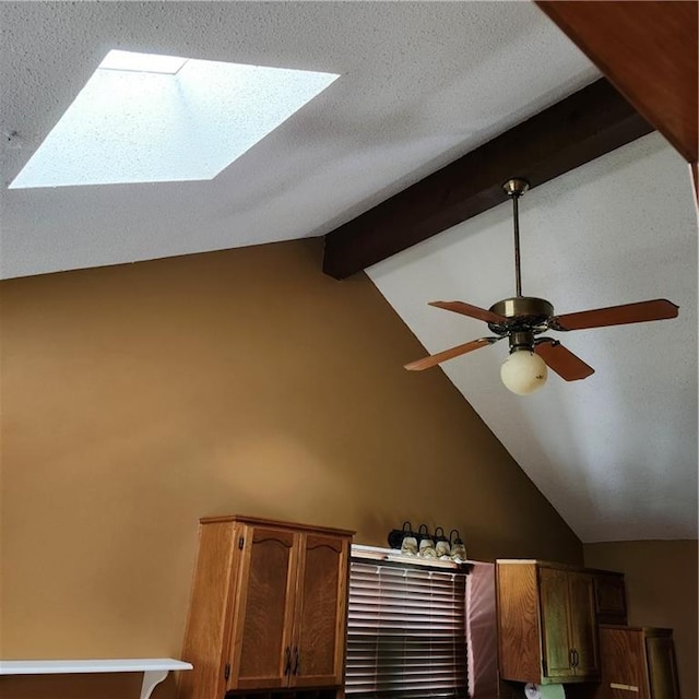 9318 Greenway Ln, Lenexa, KS 66215 - detailed view of a skylight, beamed ceiling, and a ceiling fan