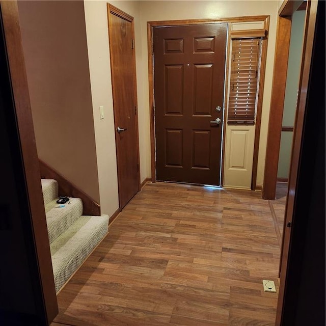 9318 Greenway Ln, Lenexa, KS 66215 - foyer with light wood-style flooring and stairs