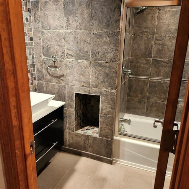 9318 Greenway Ln, Lenexa, KS 66215 - full bathroom featuring washtub / shower combination, vanity, tile patterned floors, a tiled fireplace, and tile walls