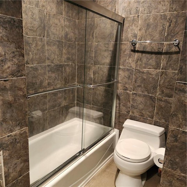 9318 Greenway Ln, Lenexa, KS 66215 - bathroom featuring shower / bath combination with glass door and tile patterned flooring
