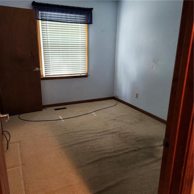 9318 Greenway Ln, Lenexa, KS 66215 - carpeted spare room with baseboards