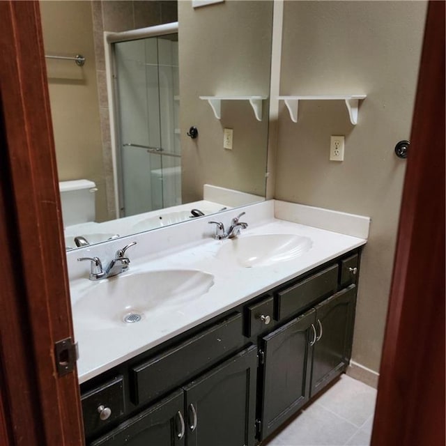 9318 Greenway Ln, Lenexa, KS 66215 - full bath featuring double vanity, a shower stall, and tile patterned floors