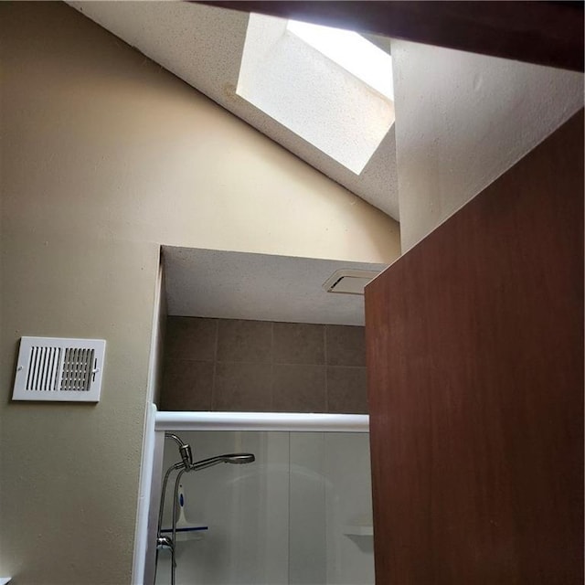 9318 Greenway Ln, Lenexa, KS 66215 - bathroom view of a skylight and a shower