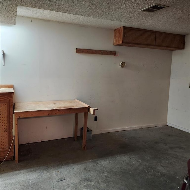 9318 Greenway Ln, Lenexa, KS 66215 - below grade area featuring a textured ceiling