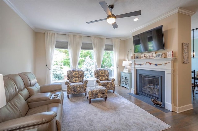 11514 W 143rd Ter, Olathe, KS 66062 - living area with crown molding, ceiling fan, a fireplace with flush hearth, and dark wood finished floors