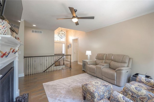 11514 W 143rd Ter, Olathe, KS 66062 - living area with a ceiling fan, wood finished floors, recessed lighting, and a fireplace