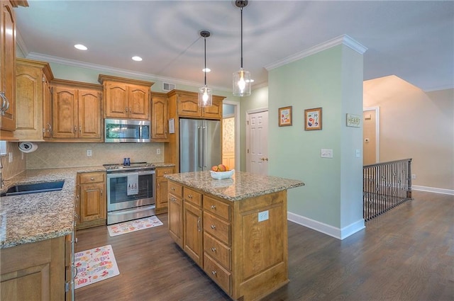 11514 W 143rd Ter, Olathe, KS 66062 - kitchen featuring stainless steel appliances, brown cabinetry, a center island, decorative backsplash, and dark wood-style floors