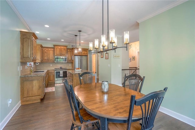 11514 W 143rd Ter, Olathe, KS 66062 - dining room with ornamental molding, dark wood-type flooring, recessed lighting, and a chandelier