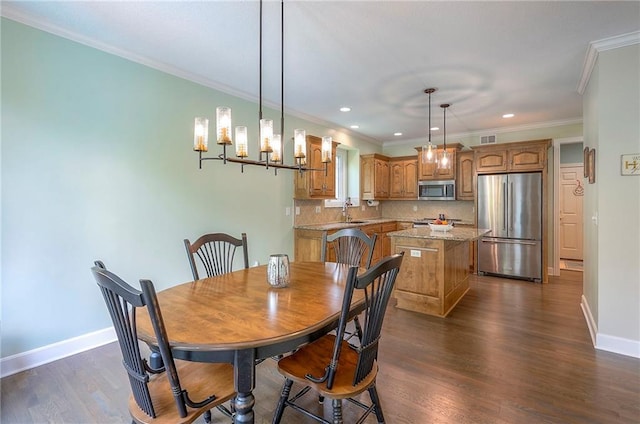 11514 W 143rd Ter, Olathe, KS 66062 - dining area with dark wood finished floors, crown molding, and recessed lighting