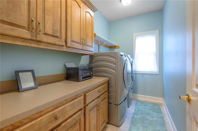11514 W 143rd Ter, Olathe, KS 66062 - laundry room with washer and clothes dryer and cabinet space