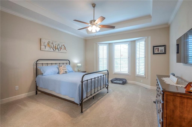 11514 W 143rd Ter, Olathe, KS 66062 - bedroom featuring light carpet, a tray ceiling, crown molding, and ceiling fan