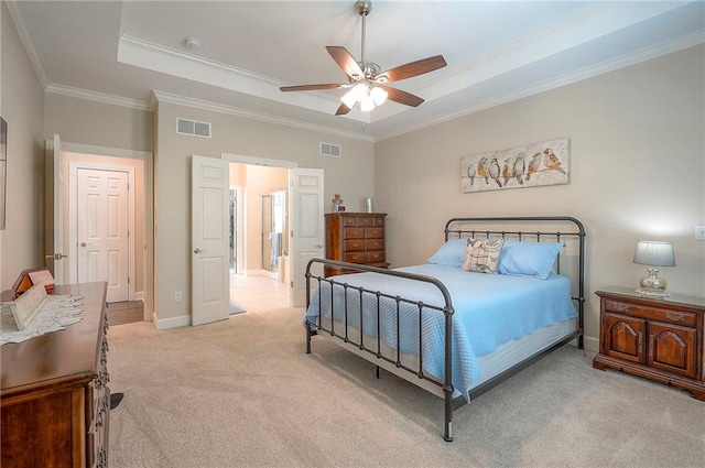 11514 W 143rd Ter, Olathe, KS 66062 - bedroom with light colored carpet, a tray ceiling, ornamental molding, and a ceiling fan