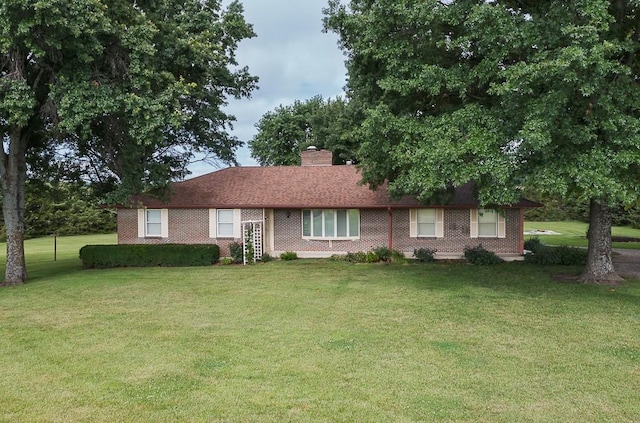 20723 Kissinger Rd, Tonganoxie, KS 66086 - single story home featuring a front lawn and a chimney