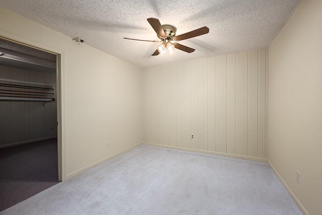 20723 Kissinger Rd, Tonganoxie, KS 66086 - unfurnished bedroom with carpet, a textured ceiling, and a ceiling fan