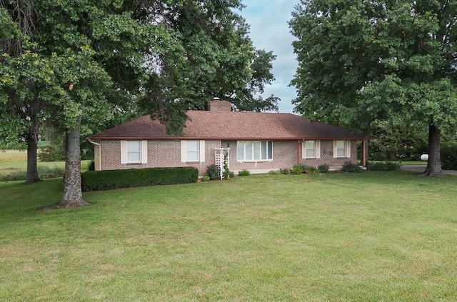 20723 Kissinger Rd, Tonganoxie, KS 66086 - ranch-style house featuring a chimney and a front yard