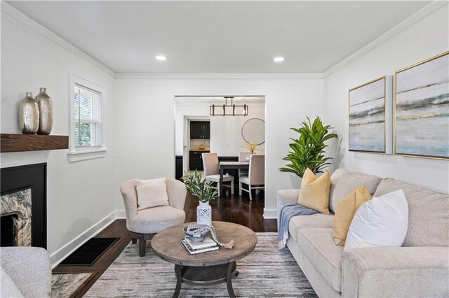 5409 Brooklyn Ave, Kansas City, MO 64130 - living area with a fireplace, wood finished floors, crown molding, a chandelier, and recessed lighting