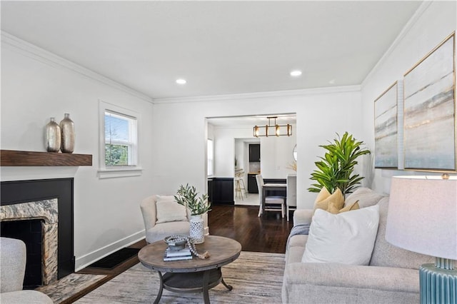 5409 Brooklyn Ave, Kansas City, MO 64130 - living area with wood finished floors, crown molding, recessed lighting, a chandelier, and a premium fireplace