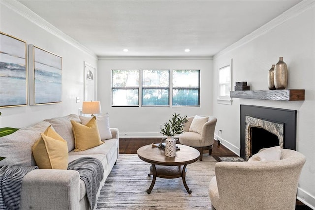 5409 Brooklyn Ave, Kansas City, MO 64130 - living room with wood finished floors, ornamental molding, healthy amount of natural light, a fireplace, and recessed lighting