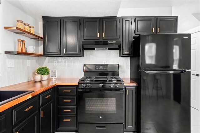 5409 Brooklyn Ave, Kansas City, MO 64130 - kitchen featuring black appliances, under cabinet range hood, dark cabinets, backsplash, and open shelves