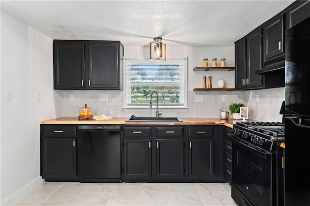 5409 Brooklyn Ave, Kansas City, MO 64130 - kitchen featuring black appliances, dark cabinetry, light marble finish flooring, backsplash, and a textured ceiling