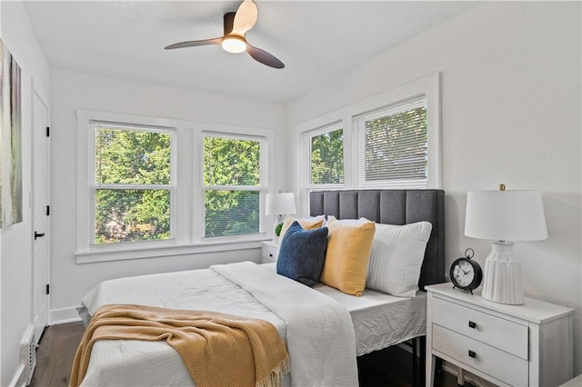 5409 Brooklyn Ave, Kansas City, MO 64130 - bedroom with wood finished floors and a ceiling fan