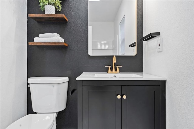 5409 Brooklyn Ave, Kansas City, MO 64130 - bathroom with vanity and a textured wall