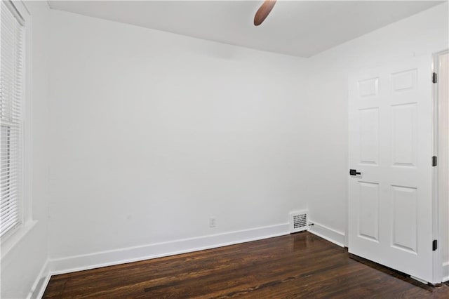 5409 Brooklyn Ave, Kansas City, MO 64130 - unfurnished bedroom with dark wood-style flooring and a ceiling fan