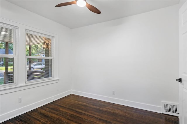 5409 Brooklyn Ave, Kansas City, MO 64130 - empty room featuring a ceiling fan and dark wood-style floors