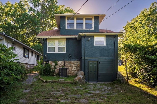 5409 Brooklyn Ave, Kansas City, MO 64130 - back of property with stucco siding and roof with shingles