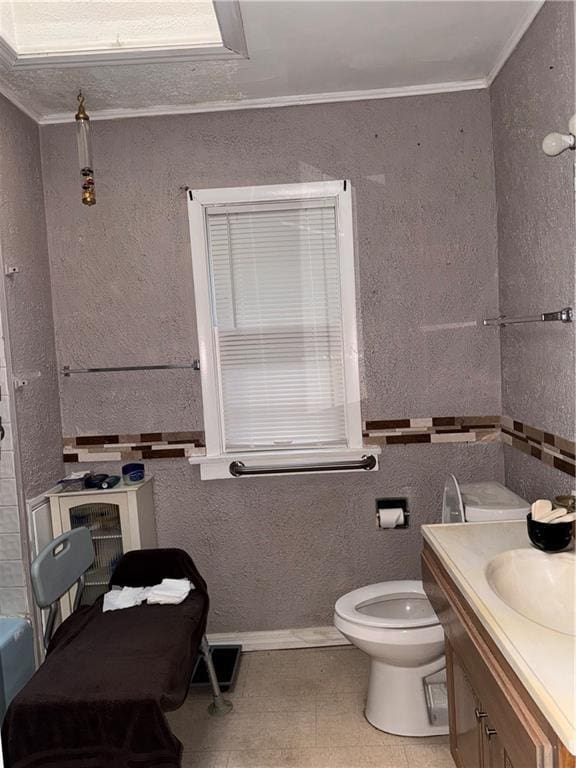 4308 Paseo Blvd, Kansas City, MO 64110 - bathroom featuring vanity and ornamental molding