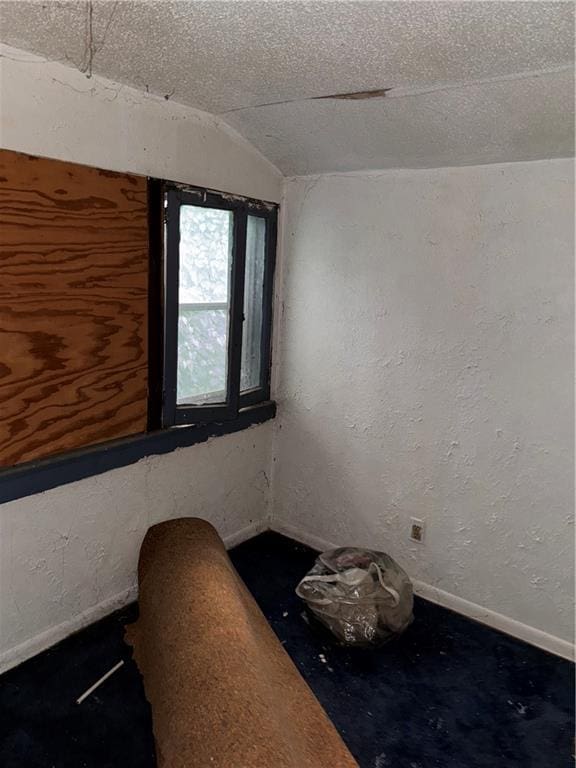 4308 Paseo Blvd, Kansas City, MO 64110 - empty room with lofted ceiling and baseboards