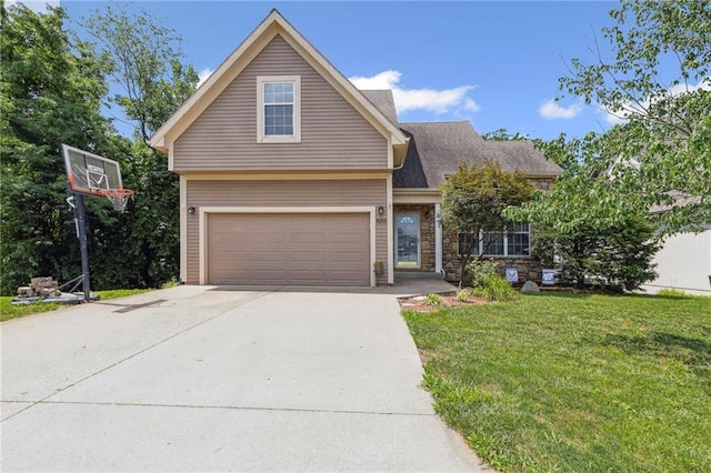 701 Redbud Dr, Paola, KS 66071 - view of front facade featuring a front lawn, driveway, an attached garage, and stone siding