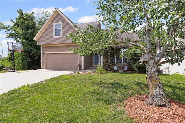 701 Redbud Dr, Paola, KS 66071 - view of front of property with driveway, a front yard, and a garage