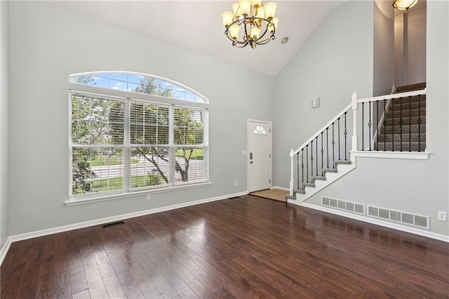 701 Redbud Dr, Paola, KS 66071 - entryway with plenty of natural light, stairs, a chandelier, and high vaulted ceiling