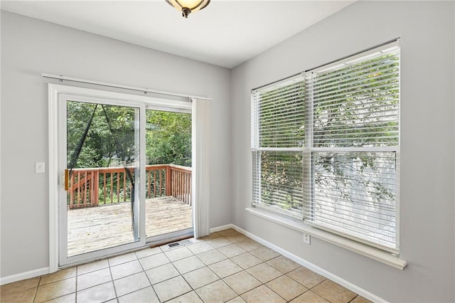 701 Redbud Dr, Paola, KS 66071 - empty room featuring baseboards and light tile patterned floors
