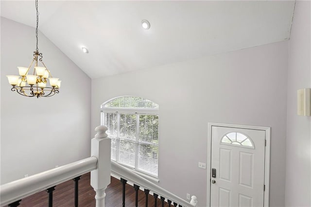 701 Redbud Dr, Paola, KS 66071 - entryway with a chandelier, vaulted ceiling, dark wood-style flooring, and recessed lighting