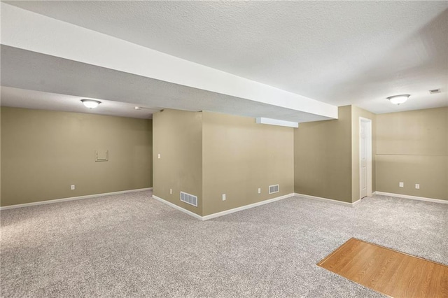 701 Redbud Dr, Paola, KS 66071 - finished basement with carpet floors and a textured ceiling