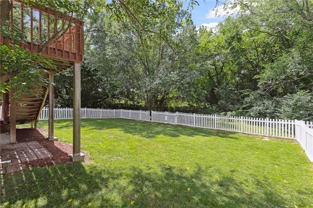 701 Redbud Dr, Paola, KS 66071 - fenced backyard with a deck