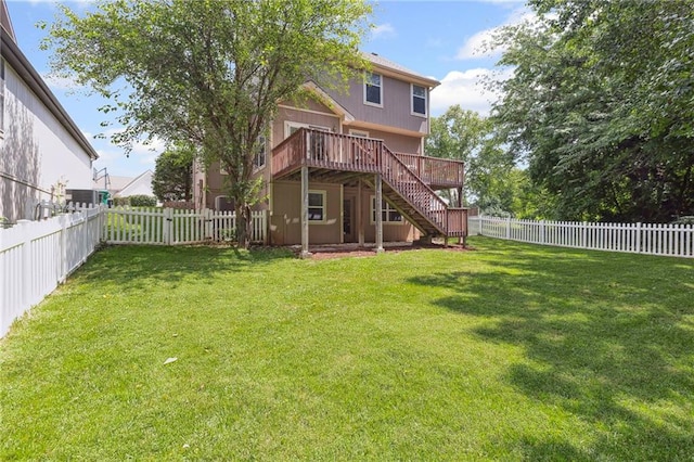 701 Redbud Dr, Paola, KS 66071 - back of house with stairs, a wooden deck, and a fenced backyard