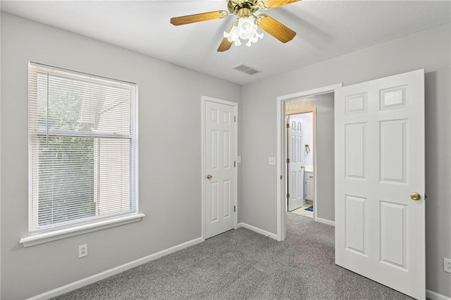 701 Redbud Dr, Paola, KS 66071 - unfurnished bedroom featuring carpet floors and a ceiling fan