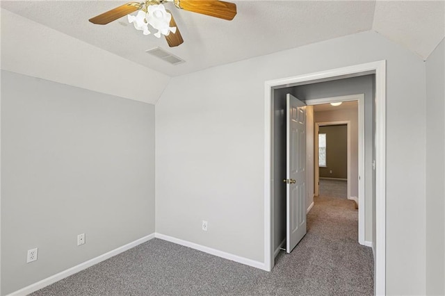 701 Redbud Dr, Paola, KS 66071 - spare room with lofted ceiling, carpet, and a ceiling fan