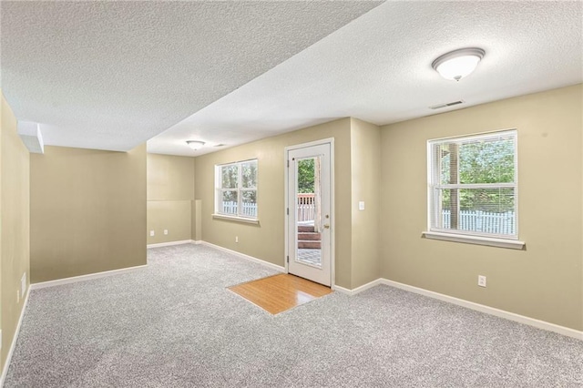 701 Redbud Dr, Paola, KS 66071 - carpeted foyer featuring a textured ceiling and baseboards