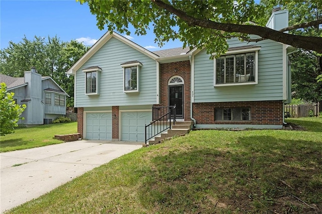 404 SE Bristol Dr, Lees Summit, MO 64063 - bi-level home with brick siding, an attached garage, concrete driveway, and a front lawn