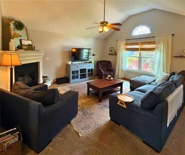 1720 SE Kenwood Dr, Blue Springs, MO 64014 - carpeted living room featuring lofted ceiling, ceiling fan, and a fireplace with raised hearth